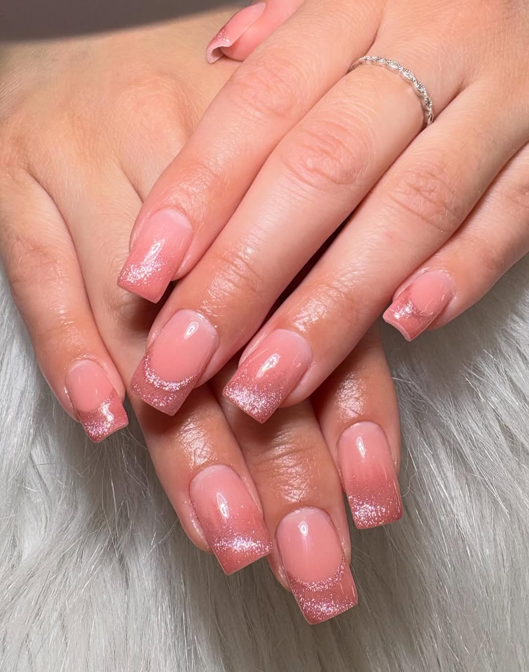 Nude nails with delicate 3D floral accents