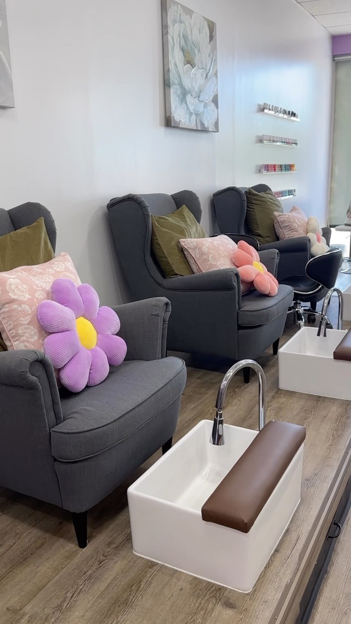 La Fleur Nail Salon pedicure area with cozy chairs and flower pillows